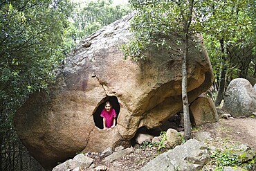 7-year-old girl in the Red rocks of Piana at the Gulf of Porto, Calanche, Corsica, France, Europe