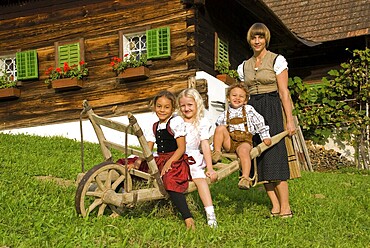 Farmwoman with children on a farm