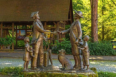 Sculpture next to the water well in the medieval mountain village of Sasbachwalden, Black Forest, Germany, Europe