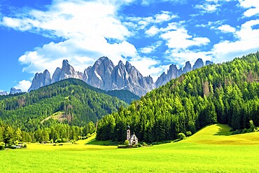Scenic summer view of the idyllic alpine valley of val di funes with st. Magdalena church and the odle mountain range in the italian dolomites