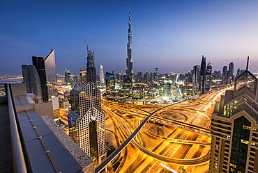 View of skyline from Shangri La Hotel at dusk, illuminated Sheikh Zayed Road, Burj Khalifa, Downtown, Dubai, United Arab Emirates, Asia