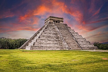 Beautiful clouds at sunrise over the famous Maya pyramid in Yucatan, Mexico that attracts millions of visitors
