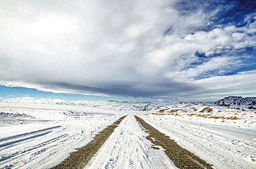 Winter snow-covered road in the Caucasus mountains a wide angle