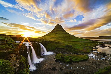 View of mount Kirkjufell and Kirkjufellfoss in Iceland at sunset