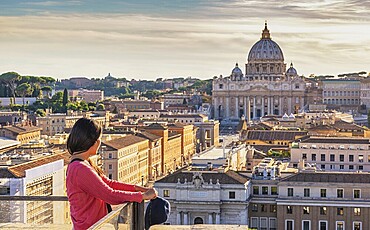 Rome Vatican Italy high angle view sunset city skyline with woman tourist