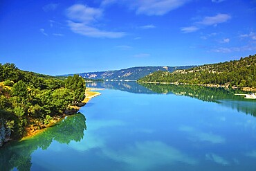 Verdon Canyon - the most spectacular in the French Alps. Spring Provence. Azure water reflects the clouds