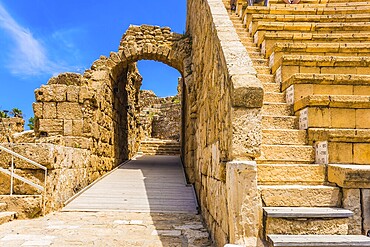 The fragment of protective walls. The oldest amphitheater in Israel. Ruins of the ancient city of Caesarea. Concept of archeological and historical tourism