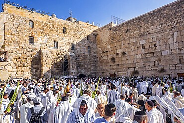 JERUSALEM, ISRAEL - SEPTEMBER 26, 2018: Touching ceremony at the Western Wall. Jews praying at the Western Wall wrapped in festive white Talit. The blessing of the Cohanim. The concept of pilgrimage