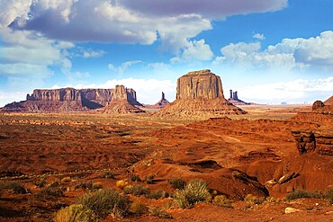 Monument Valley is a unique geological formation. The USA. Huge masses of red sandstone - outliers on the Navajo Indian Reservation. The concept of active and photo tourism