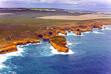 Australia. The Great Ocean Road goes along the Pacific coast. Picturesque shoreline. The picture was taken from the helicopter. The concept of extreme and active tourism