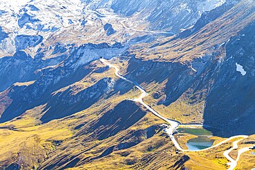 The mountain serpentine of the panoramic mountain road Grossglocknerstrasse. The Hohe Tauern Park. The slopes of the Austrian Alps are covered with colorful moss. Austria