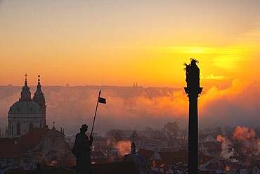 The Church of St.Nicholas in the mist. Prague, Czech Republic.This is the most famous Baroque church in Prague, stands along with the former Jesuit college in the centre of the Lesser Town Square