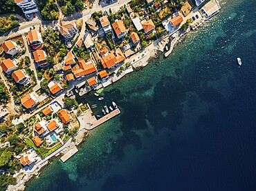 Aerial footage from the drone - villas, houses and hotels on the beach in Montenegro, the Adriatic Sea.