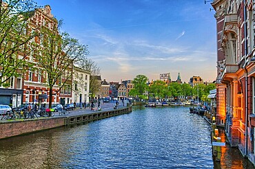 Amstel river with beautiful houses in Amsterdam, Holland, Netherlands, HDR