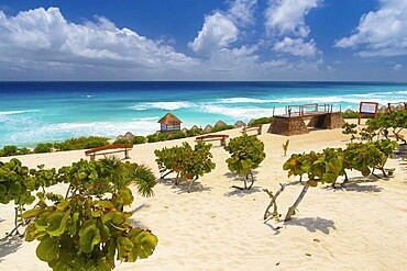 Sandy beach beach with azure blue water on a sunny day near Cancun, Mexico, Central America