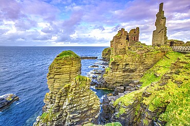 Castle Sinclair Girnigoe from Sinclair's Bay. The medieval and renaissance fortress is the most spectacular ruin in the North of Scotland, in the Highlands near Wick and Caithness. Sunset shot