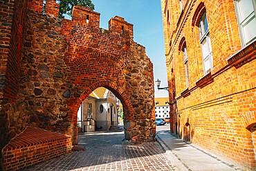 Old town ruins gate in Torun, Poland, Europe