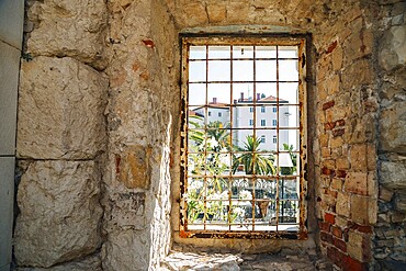 Riva street view through fortress window in Split, Croatia, Europe