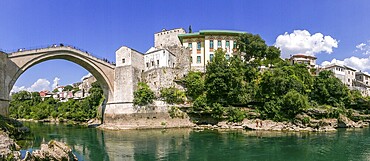 The old bridge over the river Neretva in the city of Mostar during day