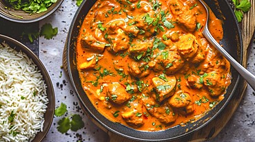 Tikka Masala Vegan, Indian Mushroom Curry served with rice and garnished with fresh coriander, KI generated, AI generated