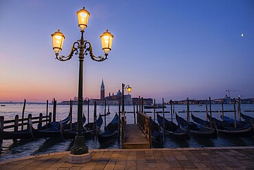 Dawn, Venetian gondolas with the church of San Giorgio Maggiore in the background, Venice, UNESCO World Heritage Site, Veneto, Italy, Europe