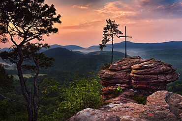 Rocks with summit cross at sunrise, forest, mountains, fog, Rötzenfels, Palatinate Forest, Germany, Europe