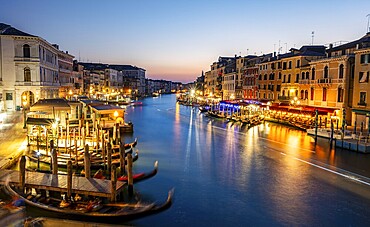 View of the Grand Canal at the blue hour, picturesque evening mood with illuminated palazzos on the canal, long exposure, view from the Rialto Bridge, Venice, Veneto, Italy, Europe