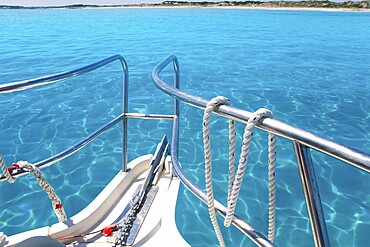 Boat in Formentera island transparent water on llevant beach