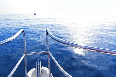 Boat bow sailing in blue calm sea ocean at blue Mediterranean