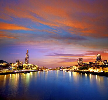 London skyline sunset with City Hall and financial on Thames river