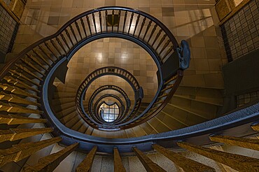Elegant spiral staircase with wooden railing in a building, abstract view from above, Kontorhausviertel, Old Town Hamburg, Free and Hanseatic City of Hamburg, Germany, Europe