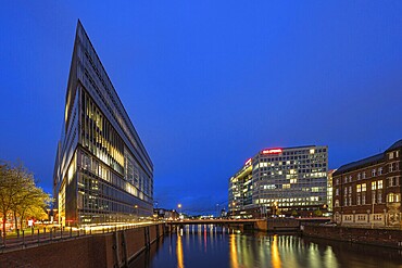 Modern office buildings reflect in the water at night, illuminated by numerous lights, Blue Hour, Deichtor Centre, Free and Hanseatic City of Hamburg, Germany, Europe