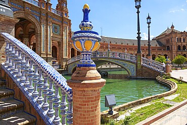 Close-up of a tiled bridge at the Plaza de España in Seville with water in the background, Seville, Spain, Europe