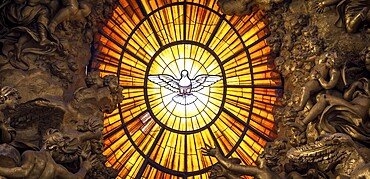 ROME, ITALY - AUGUST 24, 2018: Throne Bernini Holy Spirit Dove Saint Peters Basilica Vatican Rome Italy. Bernini created Saint Peters Throne with Holy Spirit Dove Stained Glass Amber in 1600s