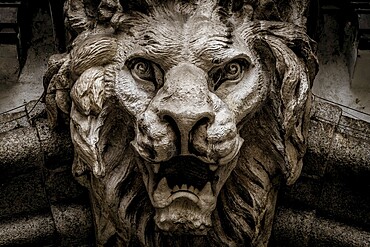 Italy, Turin. Made of stone and located on a marble arch, aroud 300 years old. Fallen angel in the shape of a roaring lion