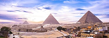 Panoramic view of pyramids and Shinx Cairo at sunset