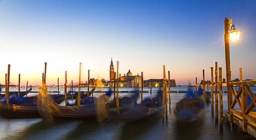 Gondolas at sunrise with San Giorgio di Maggiore church, Venice, Venezia, Italy