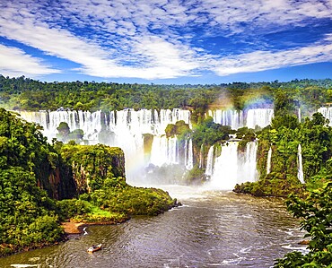 Concept of active and extreme tourism. Incredible exotic waterfalls of Iguazu in South America, on the border of three countries: Brazil, Argentina and Paraguay