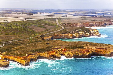 Great Ocean Road and the Twelve Apostles is a group of limestone cliffs. Scenic coastline. Picture taken from a helicopter. Port Campbell Park, Australia. The concept of extreme, active and photo tourism