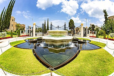 Magnificent marble fountain. Pilgrimage center and popular tourist destination. Photo taken with Fisheye lens. Bahai World Center. Mount Carmel. Haifa. Israel. Clear sunny day
