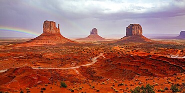 USA. Navajo Indian Reservations. The famous rock Mitten and the bright rainbow. Monument Valley is a unique geological formation in Arizona and Utah