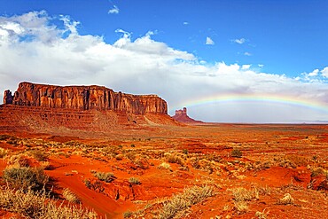 Navajo Indian Reservations. USA. Monument Valley Sentinel Mesa and the bright rainbow. Monument Valley is a unique geological formation in Arizona and Utah