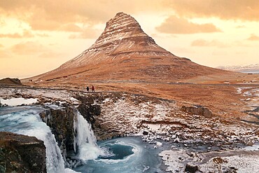 At the mountain kirkjufell and the waterfall Kirkjugellsfoss, snäfellsness peninsula, Iceland
