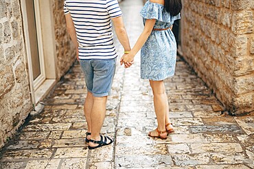 Bride and groom holding hands. Wedding in Montenegro