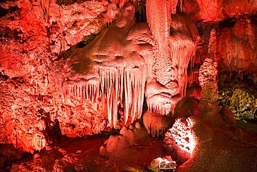 Venetsa Cave in Bulgaria. Beautiful colorful and illuminated cave full with semiprecious onyx stones. Flowstones, stalactites and stalagmites lighted in different vivid colours