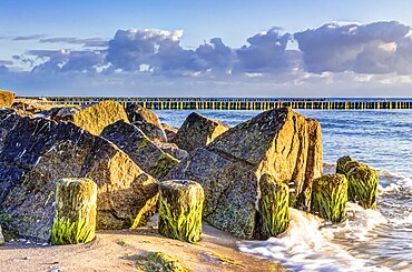 Wooden and rocky groynes on the coastline of the Baltic Sea, Germany