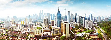 Panorama cityscape view in the middle of Kuala Lumpur city center, early morning with little mist, Malaysia
