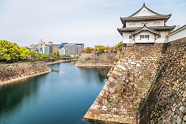Osaka castle with cherry blossoms of spring in Japan