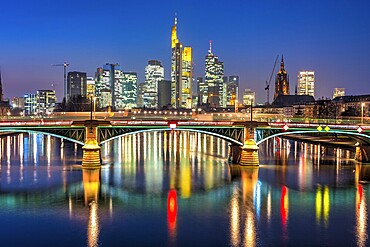 Colourfully illuminated skyscrapers in the city centre of Frankfurt am Main at dusk, Frankfurt am Main, Germany