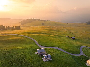 Hilly landscape at dusk in a harmonious atmosphere, Alpe di Siusi, Dolomites, South Tyrol, Italy